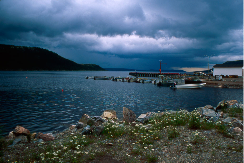Picture of shore and dock in Rigolet, Labrador, Newfoundland on a cloudy day. Photograph by Diana Ludwig via Flickr. 